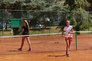 Tennis players standing together on the tennis court, poised and focused, preparing for the start of their match