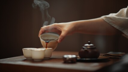 Minimalist art of making tea - A woman demonstrates a graceful tea-making style