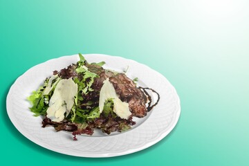 Tasty traditional food dish in plate on the desk