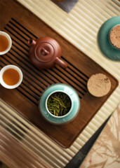 A set of tea pot and cup on the table. Tea for relaxation rituals 