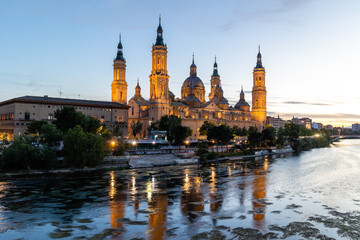 Zaragoza, Spain - May 01, 2023: ebro river, in front of the Basilica del Pilar, with very low water...