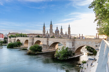 Zaragoza, Spain - May 01, 2023: medieval bridge called Puente de Piedra that crosses the Ebro river as it passes through the city of Zaragoza, Spain