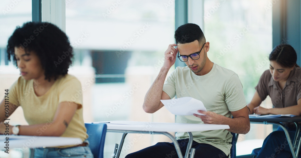 Poster Thinking, man and education test in a classroom with writing and student learning at a university. College exam, school and male person planning with document in a lecture hall with stress and paper