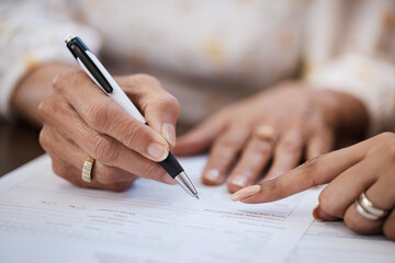 Hands, pen and closeup of a woman signing a document, contract or application with an advisor. Zoom...