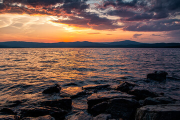 A beautiful lake against the backdrop of a scenic sunrise