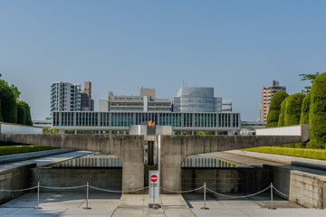 Peace Fire at Memorial Park with city buildings in background.