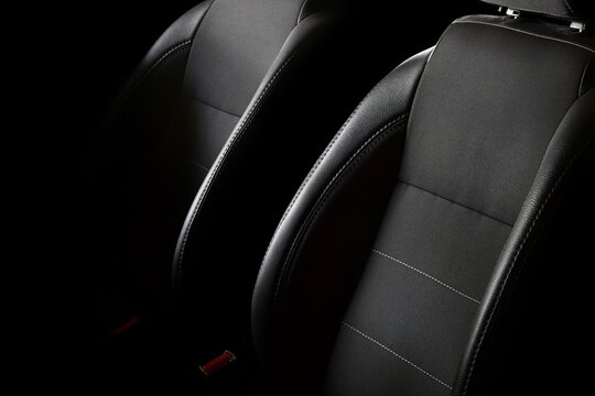 Car seats on a black background. Car seat backrests with lateral support.