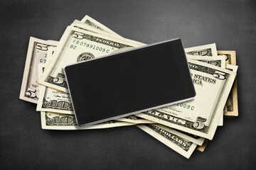 Chat GPT on screen smartphone placed on money