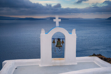 Paradise found in Santorini! This iconic image showcases the island's stunning blue domes, white houses, rugged caldera, and endless sea.