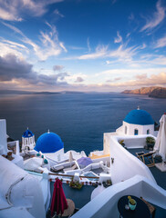 Paradise found in Santorini! This iconic image showcases the island's stunning blue domes, white houses, rugged caldera, and endless sea.