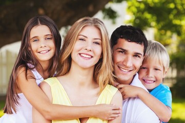 Beautiful portrait of a happy young family with child