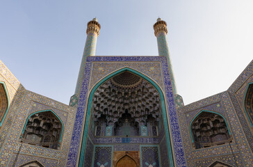 Facade of main entrance iwan of Shah Mosque on south side of Naghsh-e Jahan Square, Isfahan, Iran. UNESCO World Heritage. Architectural masterpiece.
