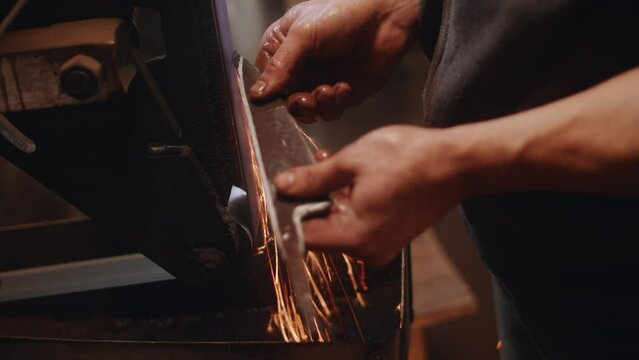 Griding and forging knife by blacksmith