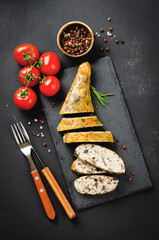 Baked Stuffed Chicken Legs on a Cutting Board, Dark Background