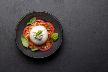 Burrata cheese, tomatoes and basil