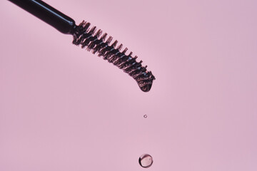 Cosmetic oil for the growth of eyebrows and eyelashes with a brush.