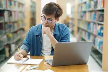 Student studying at library.