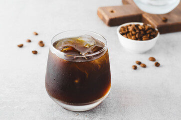 Iced Coffee, Cold Brew Coffee with Ice on Bright Background, Coffee Cocktail, Refreshing Beverage