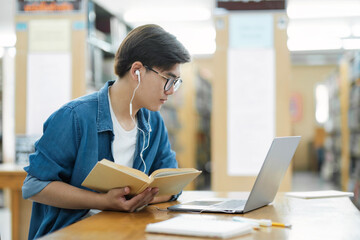 Student studying at library.