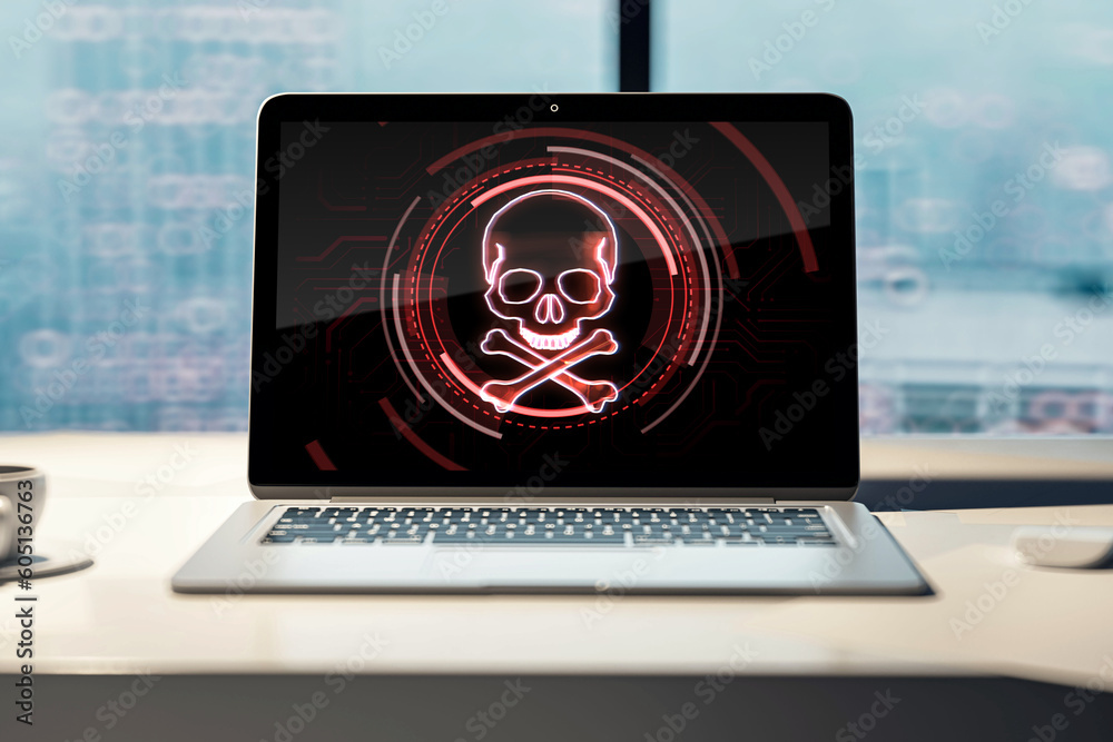 Poster laptop screen with skull and bones digital symbol on office wooden desk, hacking attack and piracy c
