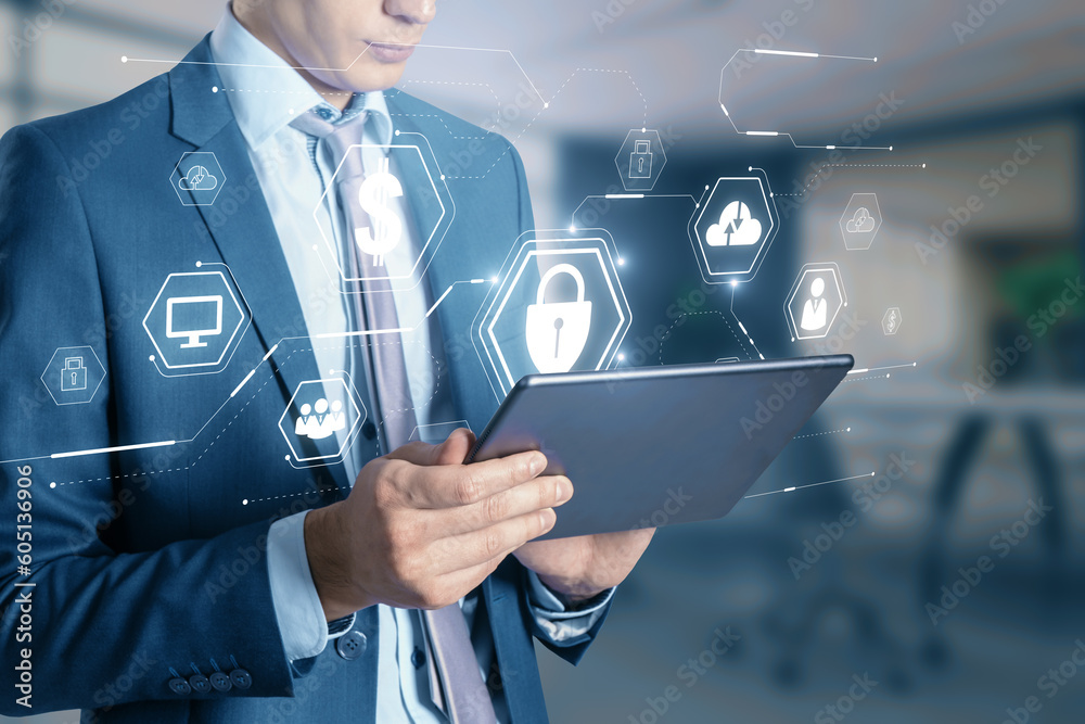 Aufkleber close up of businessman hand using tablet with glowing web security hologram with other icons on blu