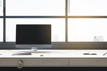 Office interior with panoramic windows and city view, blinds, empty mock up computer screen, furniture and sunlight. 3D Rendering.