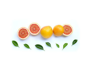 High vitamin C. Juicy grapefruit with leaves on white background. Copy space