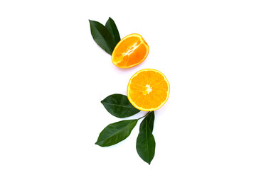 Orange fruit with green leaves on white background.