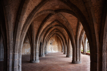 Fototapeta na wymiar Crypt with columns and arches of an old villa in Italy