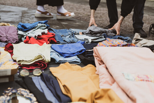 Detail of second hand clothes folded for sale at street market