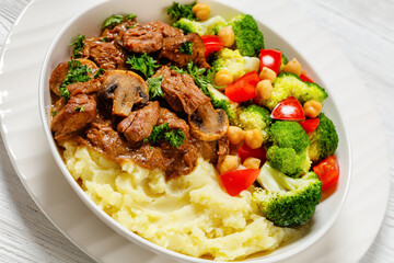 beef mushrooms stew with mashed potato and salad