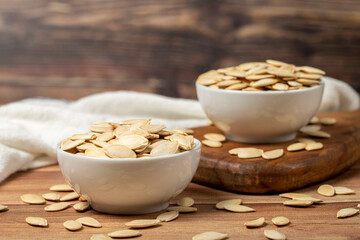 Pumpkin seeds. Sun-dried pumpkin seeds in ceramic bowl. superfood Vegetarian food concept. healthy snacks. Close up