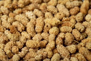 Dried mulberry. Sun-dried dried mulberry closeup food background. Texture. copy space banner