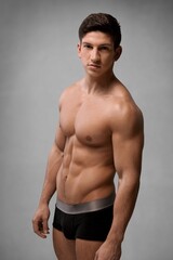 Fototapeta premium Fitness sporty young male model posing