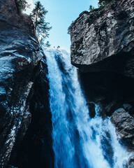waterfall on the rocks - 605160573