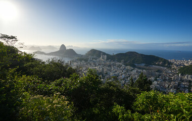 Rio de Janeiro from above during a beautiful summer morning. Aerial landscape with the skyline of Rio city, view to Sugar Loaf landmark and Copacabana beach.