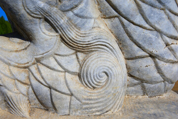 Vintage ornament on the stone. Close-up seamless texture. Stone texture. Embossed pattern.