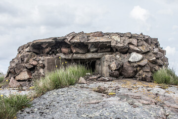 Fortifications of the Second World War in the Baltic. The bunker (pillbox) on the granite island is...