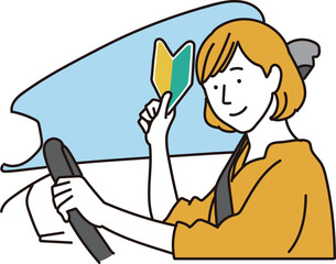 初心者マークを持つ女性ドライバー