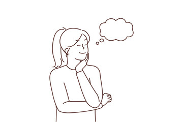 Smiling woman dreaming or imagining 