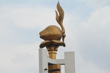a statue of the Scout Emblem in the form of a coconut shoot. This emblem is used in scout flags and...