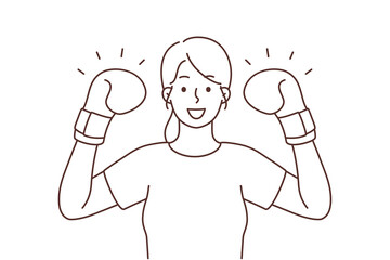 Smiling strong woman in boxers gloves 