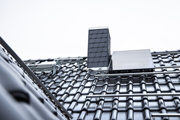 Tiled roof with a mounting system for solar panels