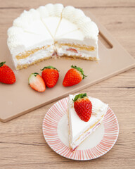Slice of fresh strawberry shortcake with whipped cream, Japanese style