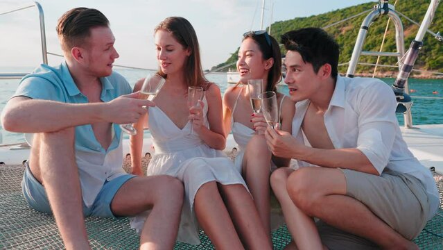 Group of Multiculturalism friends celebrating and enjoying party with drinking champagne on sail yacht, Outdoor lifestyle of the sea and travel vacation concept