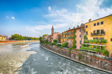 Fototapeta premium Amazing Verona cityscape view on the riverside with historical buildings ,bridges and tower
