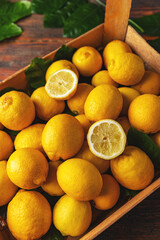 Box of ripe yellow lemons