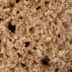 Close view of half a sliced cinnamon muffin.