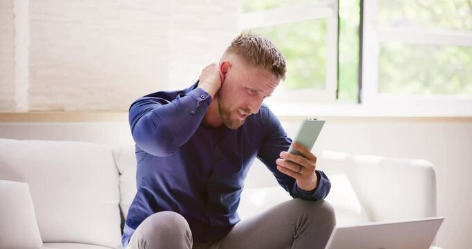 Man With Neck Pain Sitting