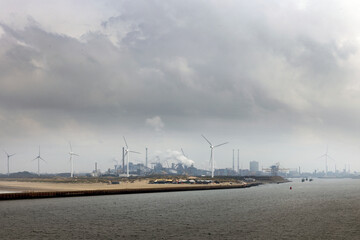 Fototapeta na wymiar Harbour of IJmuiden Netherlands. Beach and industry. Tata steel. Noordzeekanaal.